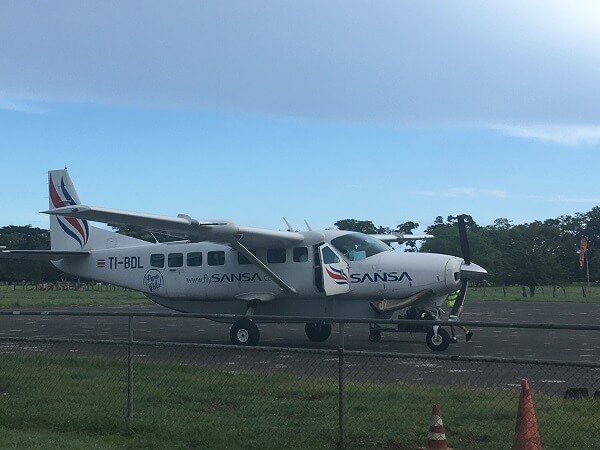 A Sansa Airlines plane sits on the ground in Tamarindo just after arrival.