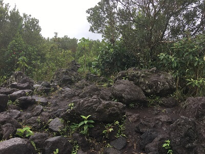 Large lava rocks mark the end of the upper trail
