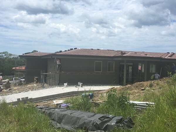 Working finish up the roof stucco color