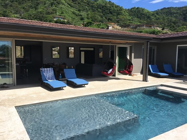 Huge sliding door opens up to the pool area.