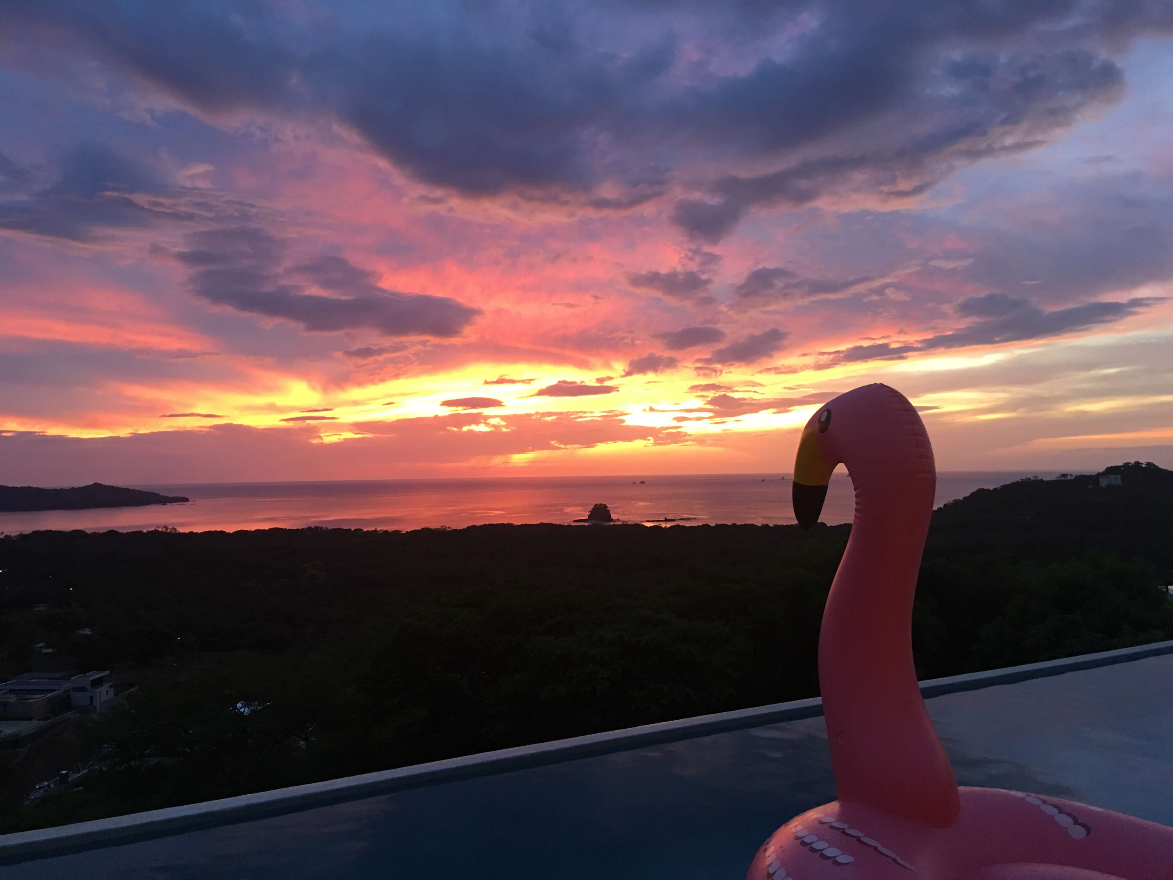 Pink, yellow and orange sky as the sun goes down in Guanacaste Costa Rica.