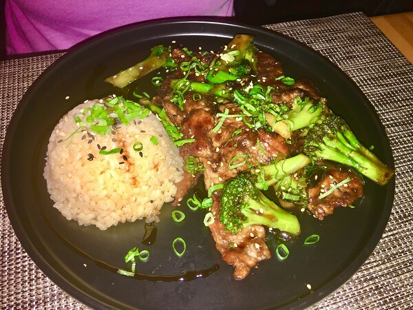 Mongolian Beef with stir fry onions, broccoli and white rice.