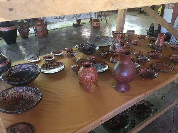 Large selection of vases and plates in various sizes.