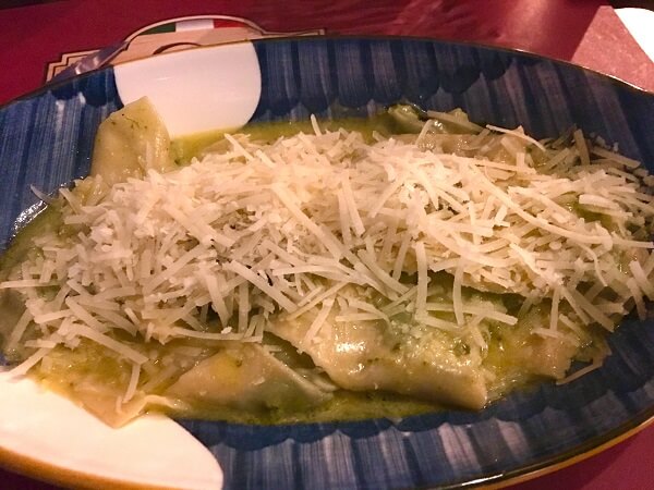 Fresh parmesan cheese over ricotta stuffed ravioli in a sage and butter sauce.