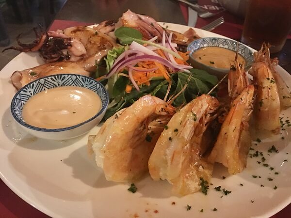 Jumbo griller shrimp, squid and a salad.