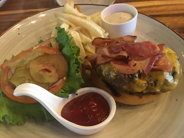 Numu's tender and juicy burger with bacon, cheese, onion, lettuce and french fries.