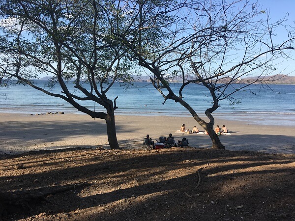 Very few people at Puerto Viejo beach on a Monday afternoon in March.