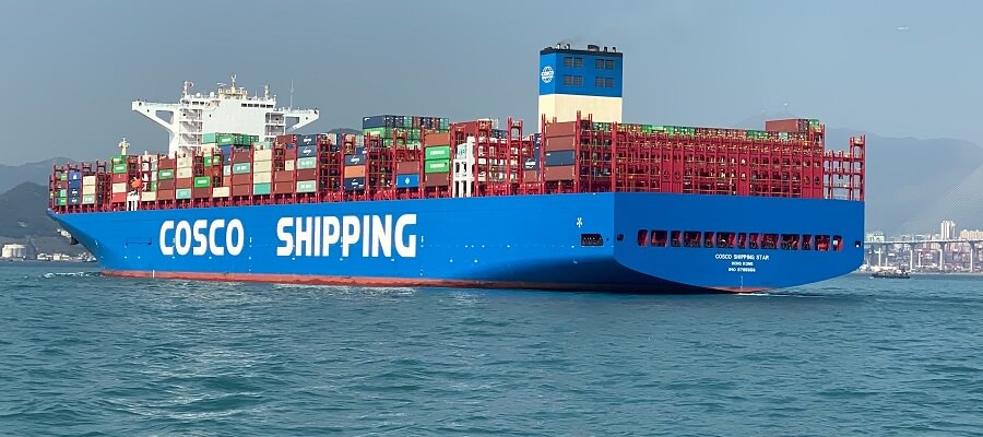 A container ship leaves port.