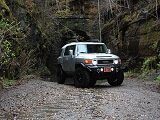 Toyota four wheel drive SUV on a dirt road in the jungle