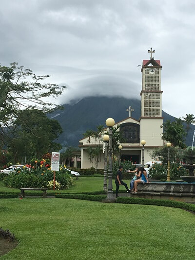 The central park in downtown La Fortuna with Arenal in the background
