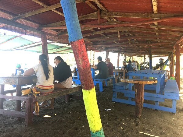 Everybody seated has views of the ocean while dining.