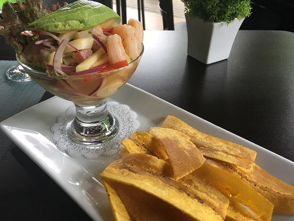 Fresh ceviche with avocados, sweet onions, and peppers with plantains.